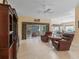 Open living space with access to the lanai and featuring tile flooring at 1642 Pennecamp Dr, The Villages, FL 32162