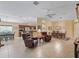 The open-concept living room connects to the dining and kitchen areas at 1642 Pennecamp Dr, The Villages, FL 32162