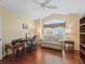 Comfortable office with a vaulted ceiling, a large window and wood floors at 1642 Pennecamp Dr, The Villages, FL 32162