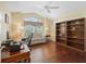 Comfortable office with a vaulted ceiling, a large window and wood floors at 1642 Pennecamp Dr, The Villages, FL 32162