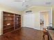 Comfortable office with a vaulted ceiling, a large window and wood floors at 1642 Pennecamp Dr, The Villages, FL 32162