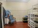 Large walk-in closet offering ample storage with wire shelving and wooden floors at 1642 Pennecamp Dr, The Villages, FL 32162
