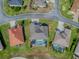 Aerial view of the beautiful home featuring a screened pool and perfectly manicured lawn at 17563 Se 122Nd Ter, Summerfield, FL 34491