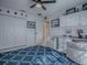 Versatile bonus room featuring built-in storage, a patterned rug, and stylish seating for flexible living at 17563 Se 122Nd Ter, Summerfield, FL 34491