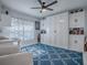 Versatile bonus room featuring built-in storage, a patterned rug, and stylish seating for flexible living at 17563 Se 122Nd Ter, Summerfield, FL 34491