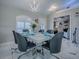 Dining room featuring modern table and view into the living area at 17563 Se 122Nd Ter, Summerfield, FL 34491