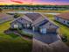 Beautiful home featuring a three-car garage and brick paver driveway at 17563 Se 122Nd Ter, Summerfield, FL 34491