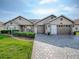Attractive single-story home with brick paver driveway and three-car garage at 17563 Se 122Nd Ter, Summerfield, FL 34491