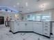 Bright, spacious kitchen with a large sink, dishwasher, and plenty of counter space at 17563 Se 122Nd Ter, Summerfield, FL 34491