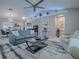 Beautiful living room featuring vaulted ceilings, modern decor, and plenty of natural light at 17563 Se 122Nd Ter, Summerfield, FL 34491