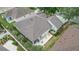Birds eye view of the property showcasing the backyard, patio, and neighboring homes at 1828 Hollow Branch Way, The Villages, FL 32162