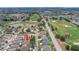 Beautiful aerial view of a golf course community showcasing lush landscaping and serene water features at 1828 Hollow Branch Way, The Villages, FL 32162