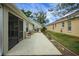 Large concrete patio offers space for entertaining in this backyard at 1828 Hollow Branch Way, The Villages, FL 32162