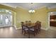Cozy dining room with hardwood floors and room for a large table at 1828 Hollow Branch Way, The Villages, FL 32162