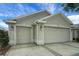 Spacious three-car garage offering ample parking and storage at 1828 Hollow Branch Way, The Villages, FL 32162