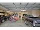 Spacious garage featuring ample storage, space for multiple vehicles, and room for leisure activities at 1828 Hollow Branch Way, The Villages, FL 32162