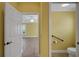 Interior view with bedroom and bathroom visible through open doorways at 1828 Hollow Branch Way, The Villages, FL 32162