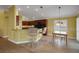 Kitchen and dining area with breakfast bar, granite counters, and stainless appliances at 1828 Hollow Branch Way, The Villages, FL 32162