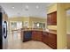 Kitchen featuring stainless steel appliances, granite countertops, and tile backsplash and floors at 1828 Hollow Branch Way, The Villages, FL 32162