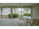 Screened patio offers a ceiling fan and beautiful view of the backyard landscaping at 1828 Hollow Branch Way, The Villages, FL 32162