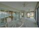 Covered patio with ceiling fans offers ample space for relaxing and entertaining at 1828 Hollow Branch Way, The Villages, FL 32162