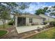 Relaxing screened patio with comfortable seating, perfect for enjoying the outdoors at 1828 Hollow Branch Way, The Villages, FL 32162