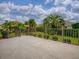 Backyard patio featuring fenced in yard with tropical landscaping at 2044 Larkwood Ct, The Villages, FL 32162