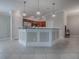 Contemporary kitchen featuring pendant lighting, stainless steel appliances, and a breakfast bar at 2044 Larkwood Ct, The Villages, FL 32162