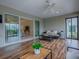 Comfortable lanai with sliding glass doors leading to the interior and exterior views of the surrounding landscape at 2044 Larkwood Ct, The Villages, FL 32162
