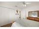 Bedroom with closet, dresser, hardwood floors, and ceiling fan at 2096 Callaway Dr, The Villages, FL 32162