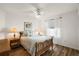 Cozy bedroom with hardwood floors, soft lighting, and window with curtains at 2096 Callaway Dr, The Villages, FL 32162