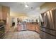 Well-lit kitchen with stainless steel appliances, granite countertops, and an open design at 2096 Callaway Dr, The Villages, FL 32162