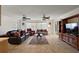 Expansive living room featuring tile floors, multiple seating areas, and abundant natural light at 2096 Callaway Dr, The Villages, FL 32162