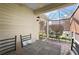 Enclosed patio with tile flooring, outdoor furniture, and a screened enclosure at 2096 Callaway Dr, The Villages, FL 32162