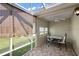 Patio with tile flooring, outdoor furniture, screened enclosure, and ceiling fan at 2096 Callaway Dr, The Villages, FL 32162