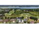 Aerial view highlighting the home's location, golf course, and lake, with a property outline at 2125 Horizon Run, The Villages, FL 32162