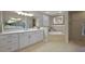 Bathroom featuring double vanities, soaking tub, and tile shower at 2125 Horizon Run, The Villages, FL 32162