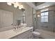 Bright bathroom with a white vanity, quartz countertop and a glass enclosed shower at 2125 Horizon Run, The Villages, FL 32162
