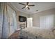 Bedroom featuring a ceiling fan, closet, and private entry at 2125 Horizon Run, The Villages, FL 32162