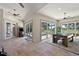 Expansive game room with tile floors, a pool table, and access to the pool and patio at 2125 Horizon Run, The Villages, FL 32162