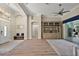 Open concept living room with high ceilings, modern ceiling fan, and stylish decor at 2125 Horizon Run, The Villages, FL 32162