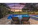 Relaxing screened pool with spa and tranquil golf course views, ideal for unwinding and enjoying the scenery at 2125 Horizon Run, The Villages, FL 32162