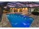 View of the screened in pool with hot tub, and surrounding lounge area at 2125 Horizon Run, The Villages, FL 32162