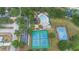 Aerial view of a community pool, tennis courts, and basketball court at 2304 Clementine Trl, Clermont, FL 34714