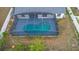 Overhead view of a screened-in pool in the home's backyard at 2304 Clementine Trl, Clermont, FL 34714