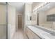 Open primary bathroom featuring dual vanities and sinks, bathtub, and walk-in shower at 2304 Clementine Trl, Clermont, FL 34714
