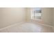 Neutral bedroom featuring tile floor, light walls and a view outside at 2304 Clementine Trl, Clermont, FL 34714