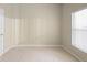 Bright bedroom with neutral walls, tile floor, window and baseboard trim at 2304 Clementine Trl, Clermont, FL 34714