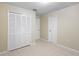 Bedroom features light walls, tile floor, and closet with doors at 2304 Clementine Trl, Clermont, FL 34714