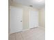 Bedroom featuring light walls, tile floor and closet with doors at 2304 Clementine Trl, Clermont, FL 34714